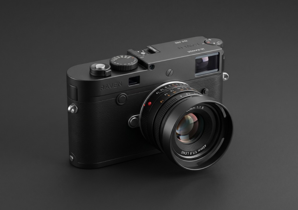 Rangefinder-style camera with a prime lens on a dark background